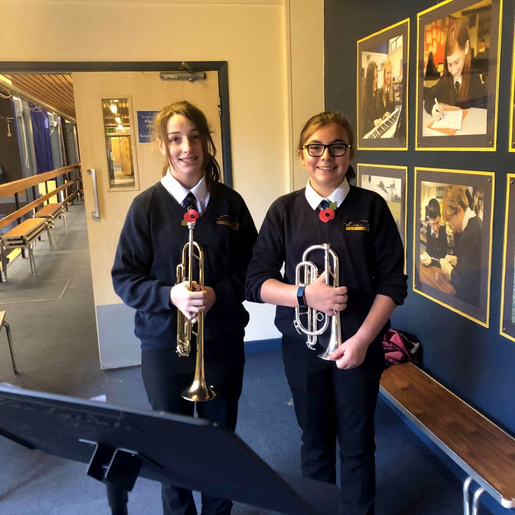 Students prepare to play The Last Post on Remembrance Day