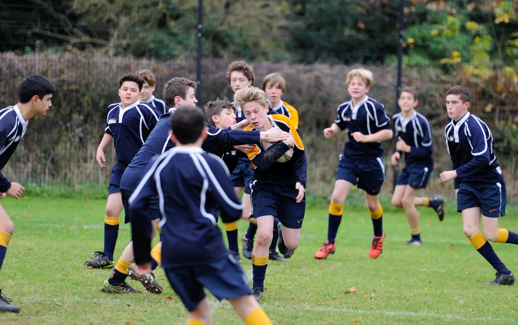 Boys playing rugby