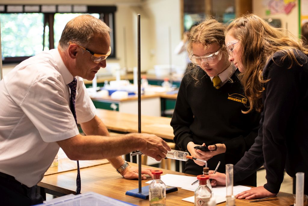 Science teacher and students