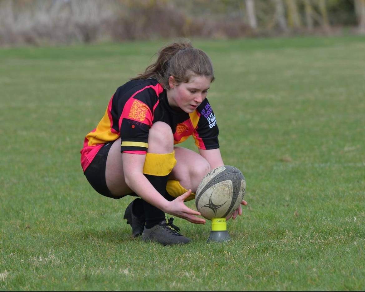 Aimee crouching down 